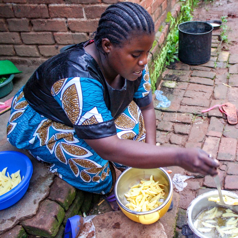 Woman cooking a traditional meal in Malawi